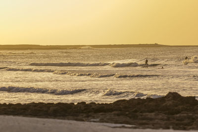 Scenic view of sea against sky during sunset