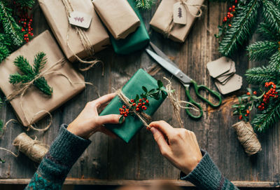 Cropped hand of woman holding gift