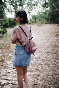 Woman walking on footpath