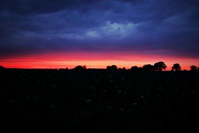 Silhouette of landscape against dramatic sky