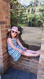 Portrait of young woman sitting on steps