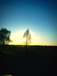 Scenic view of landscape against sky at dusk