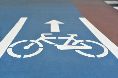 High angle view of arrow sign on road