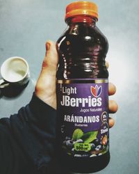 Close-up of hand holding glass