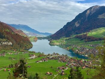 Scenic view of lake and mountains against sky