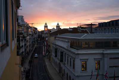 High angle view of buildings in city against sky during sunset