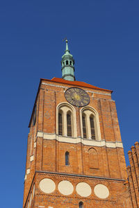 Low angle view of church against clear blue sky