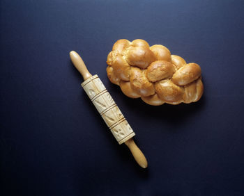 High angle view of bread in plate against black background