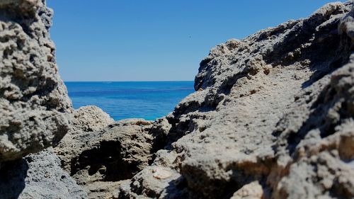 Scenic view of sea against clear blue sky