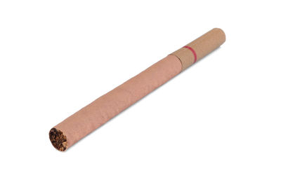 Close-up of cigarette against white background