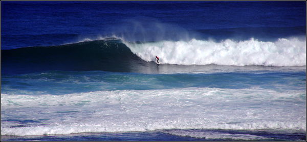 Scenic view of waves splashing on beach