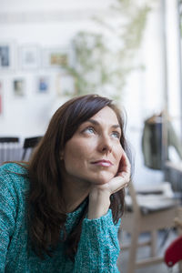 Portrait of young woman looking away