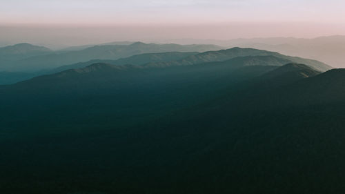 Scenic view of mountains against sky during sunset