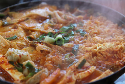 Close up of korean army stew or budae jjigae hot pot at korean restaurant, busan, south korea