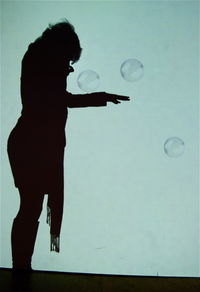 Woman standing in bubbles