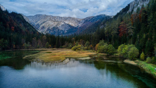 Scenic view of lake and mountains against sky