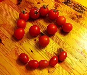 Close-up of wooden tomatoes on wooden table