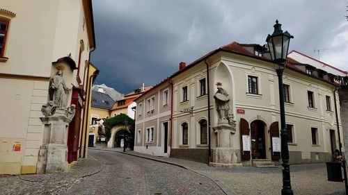 Street amidst buildings against sky