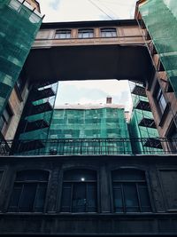 Low angle view of modern building in city against sky