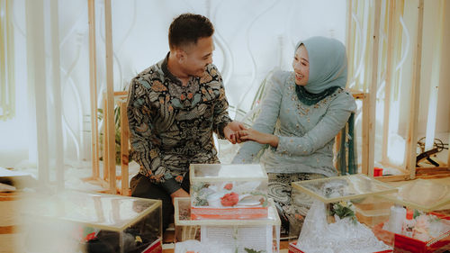 Young couple standing in corridor