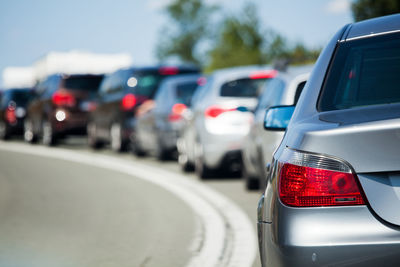 Close-up of red car on road