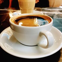 Close-up of coffee cup on table