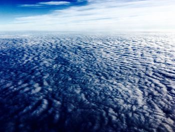 View of calm sea against cloudy sky