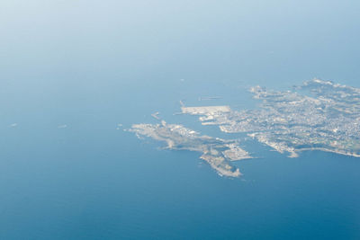 Aerial view of sea and island against sky