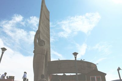 Low angle view of built structure against blue sky