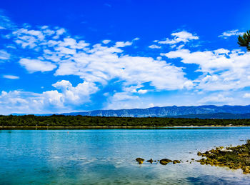 View of lake against cloudy sky