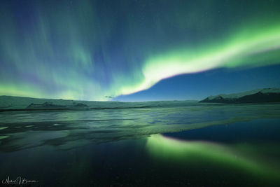 Scenic view of sea against sky at night