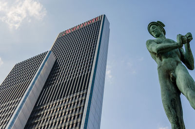 Low angle view of statue against building