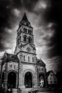 Low angle view of church against cloudy sky