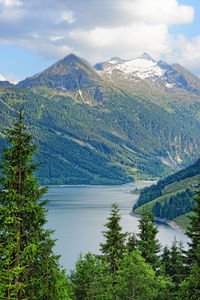 Scenic view of lake and mountains against sky