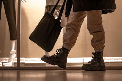 Low section of man standing on floor