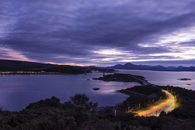 Scenic view of lake against sky at sunset