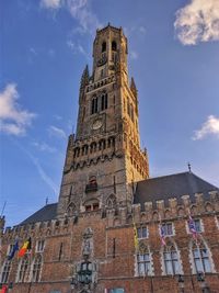 Low angle view of clock tower against sky