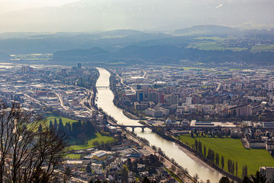 Aerial view of innsbruck city, austria showing the long river running through the city
