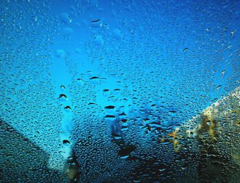 Close-up of water drops on glass window