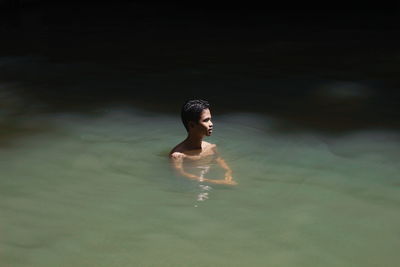 Man swimming in pool