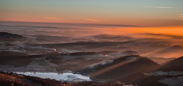 Scenic view of mountains against sky during sunset