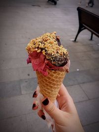 Hand holding ice cream cone