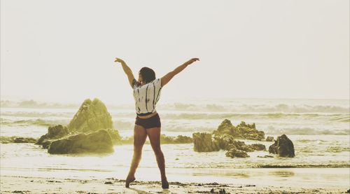 Woman standing on beach