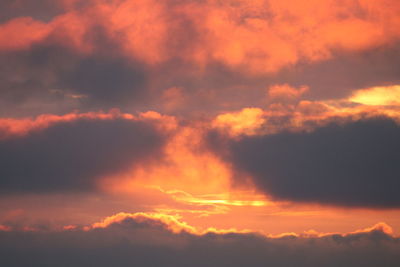 Low angle view of dramatic sky during sunset