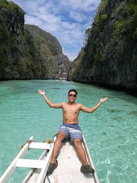 Young man on boat on sea