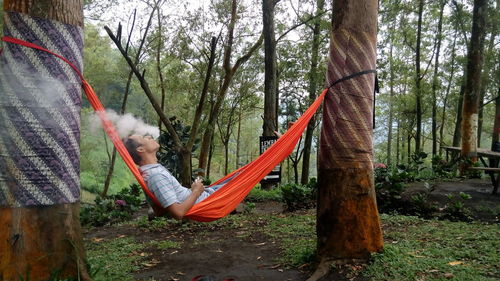 Panoramic shot of people on hammock at playground