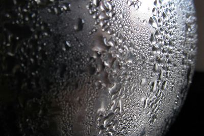 Close-up of water drops on glass window