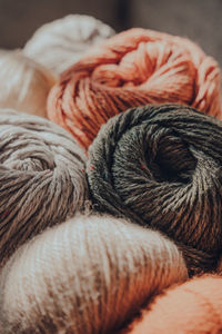 Close up of earth coloured coloured skeins of wool yarn, selective focus.