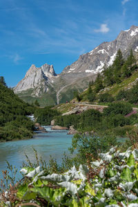 Scenic view of lake and mountains against sky