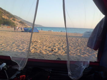 Scenic view of beach against clear sky